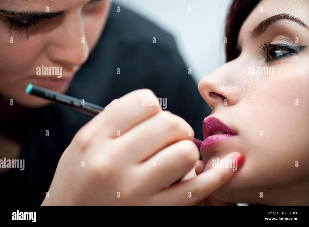 Makeup artist working Stock Photo
