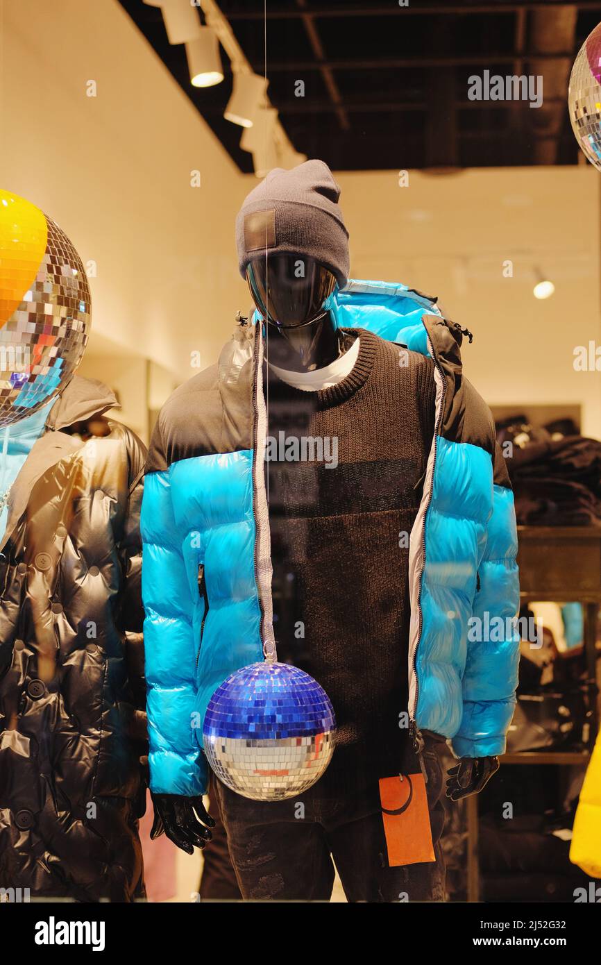 Mannequins in the big shopping shop. Mannequins in casual clothes stand in a clothing store. Stock Photo
