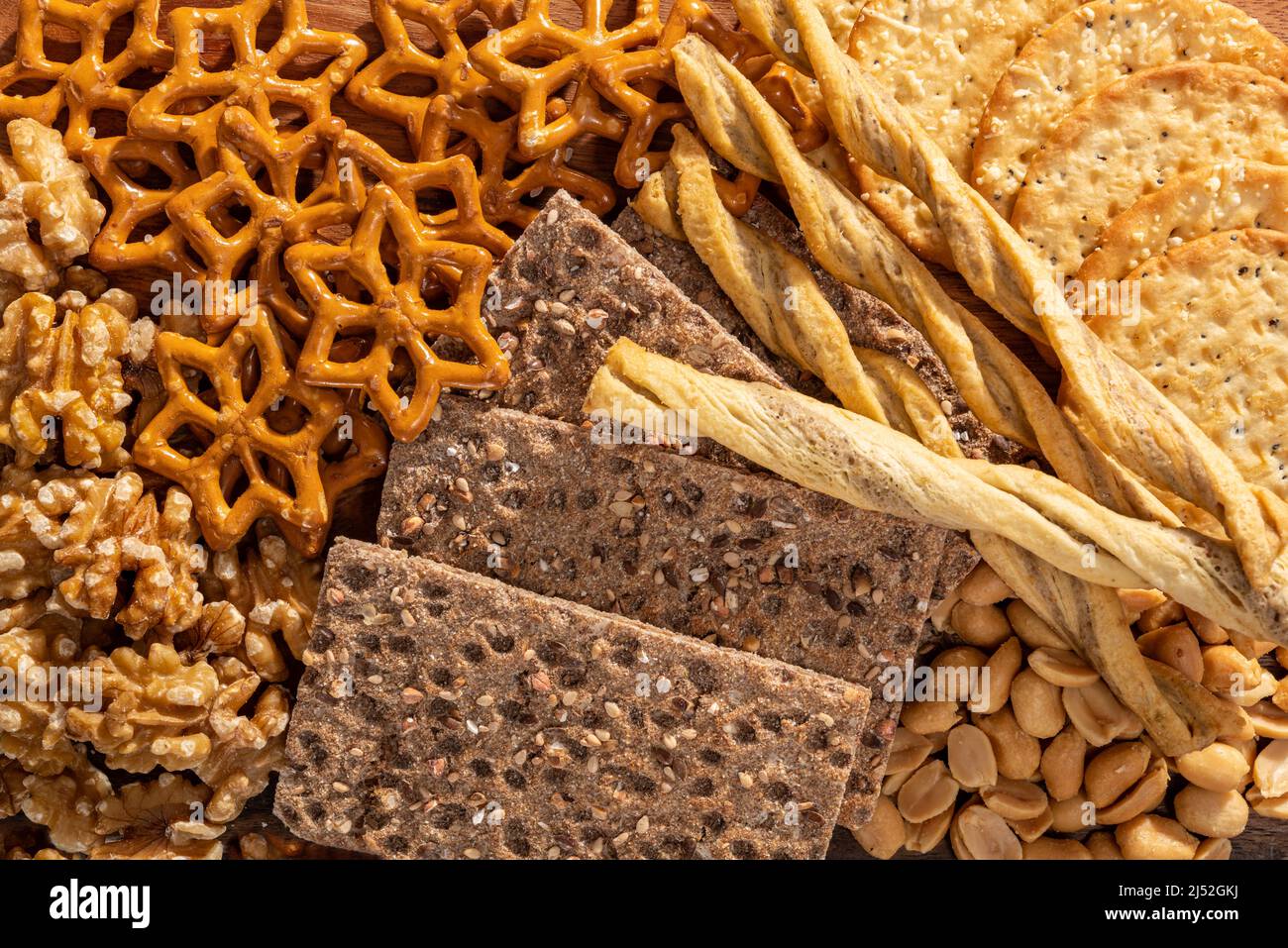 Cured cheese and meze platter setup rich in variety of fruits, cheese, meat and crackers Stock Photo