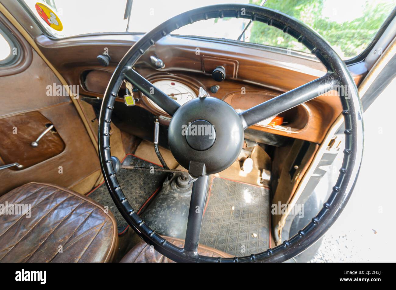 Steering wheel and interior of a 1938 Hillman Minx Stock Photo