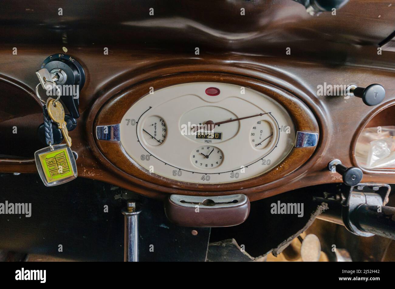 Dashboard including speedometer, odometer, oil pressure and temperature gauges in the interior of a 1938 Hillman Minx Stock Photo