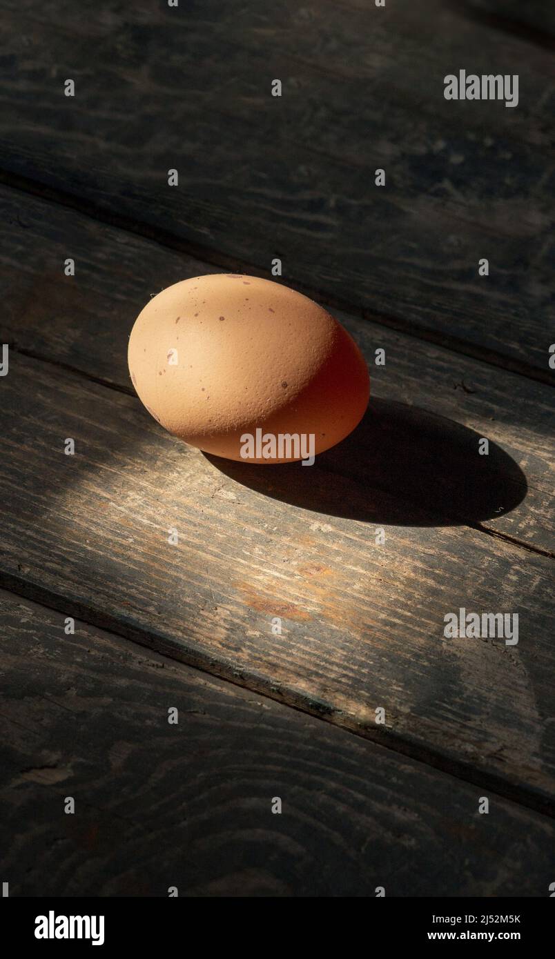 Chicken egg on a wooden background. Concept: market, eggs, food Stock Photo