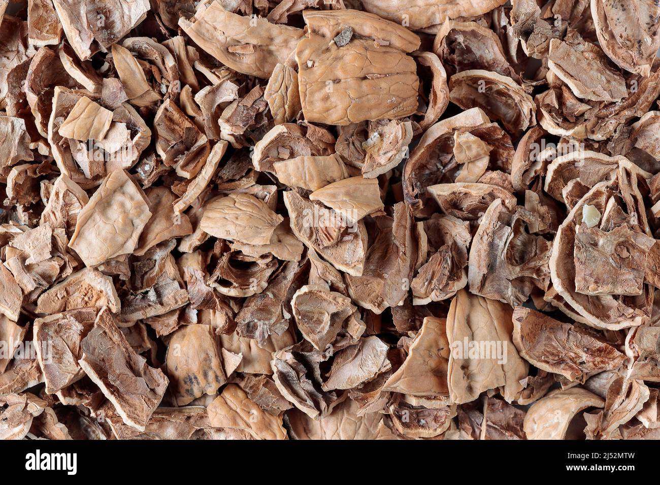 background with crushed walnut shells to be used as fertilizer for