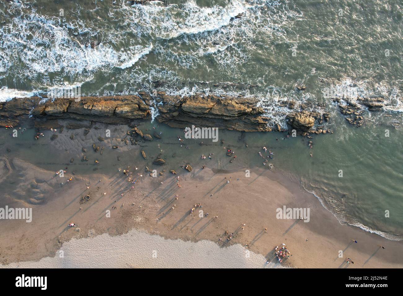 People on beach coast above drone top view Stock Photo