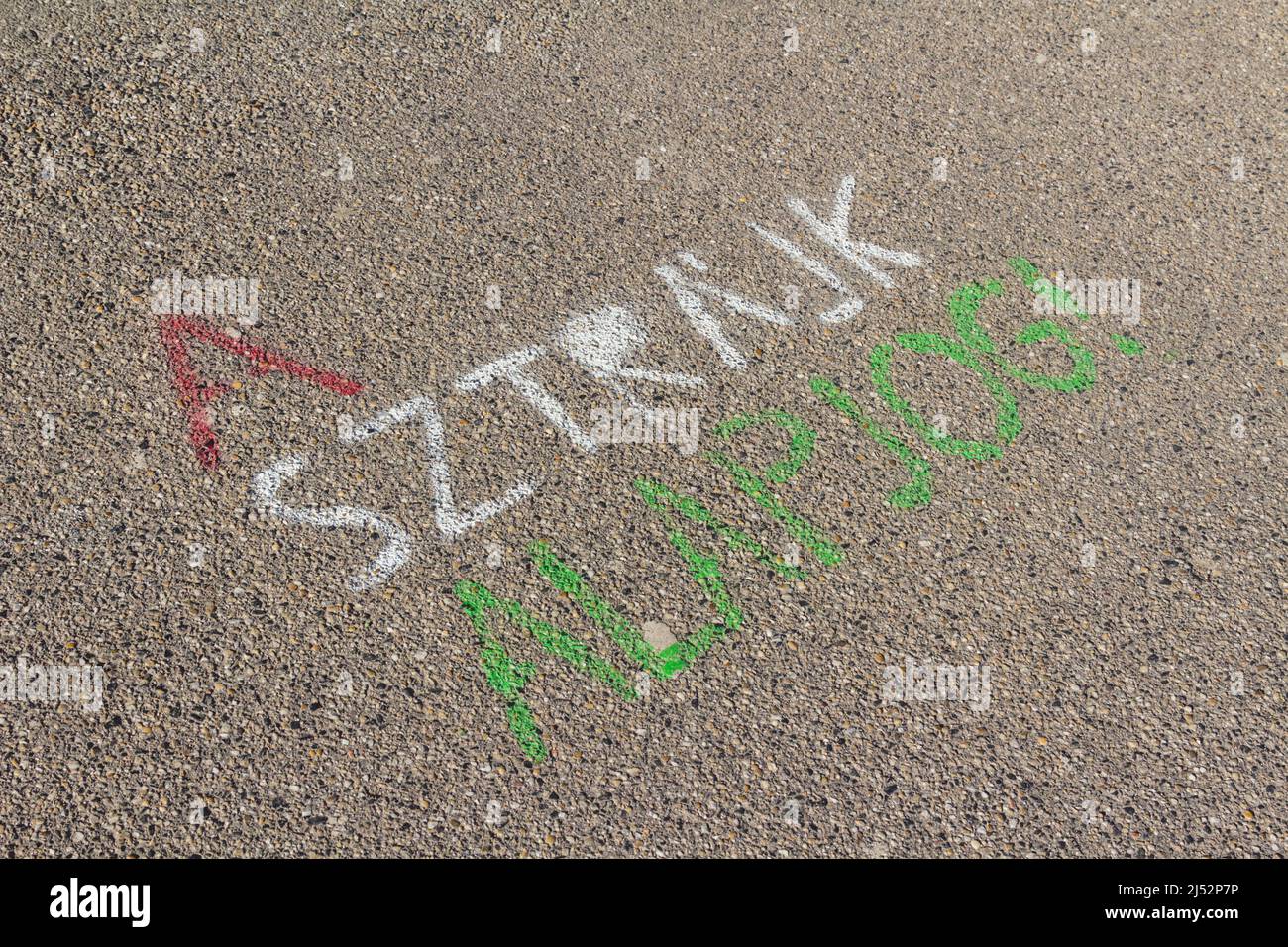 'A sztrajk alapjog' (Strike is fundamental right) painted on sidewalk in tricolour of Hungary Stock Photo