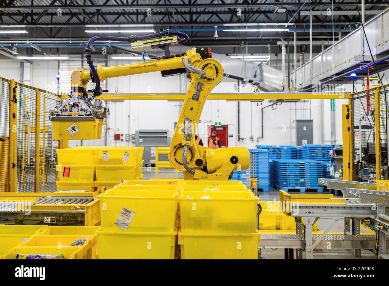 Amazon packages are sorted by a robotic arm during a tour of the advanced  robotics facility fulfillment centre, YHM1, in Hamilton, Ontario, Canada  April 19, 2022. REUTERS/Nick Iwanyshyn Stock Photo - Alamy