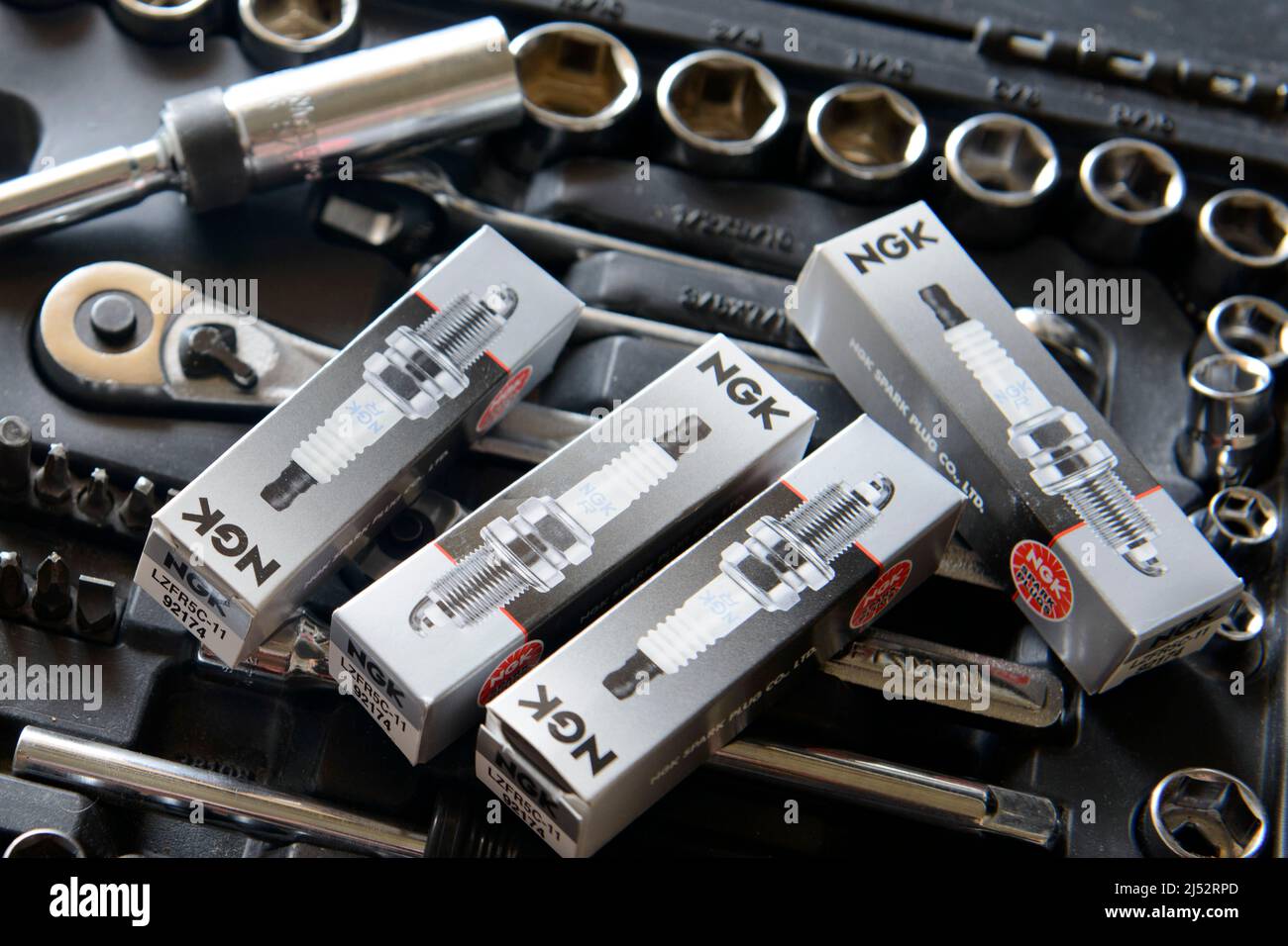 Vehicle spark plugs ready to go into a six cylinder engine Stock Photo