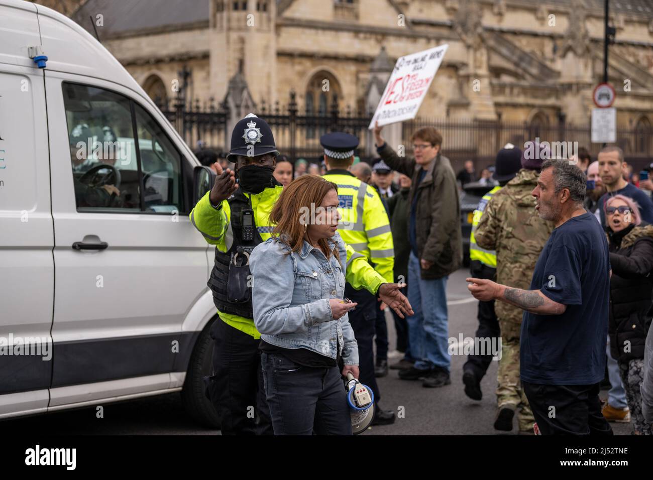 London, UK. 19th Apr, 2022. a small demonstration of anti vaxers, anti On Line Harm bill and Freedom party demonstrators blocked the entrance to the House of Commons causing large scale traffic disruption. The protesters later moved on to Downing Street where they blocked the entrance with a sit down protest Credit: Ian Davidson/Alamy Live News Stock Photo