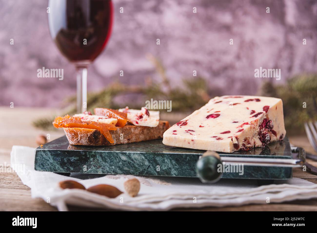 A slice of British Wensleydale and Cranberry cheese. Stock Photo