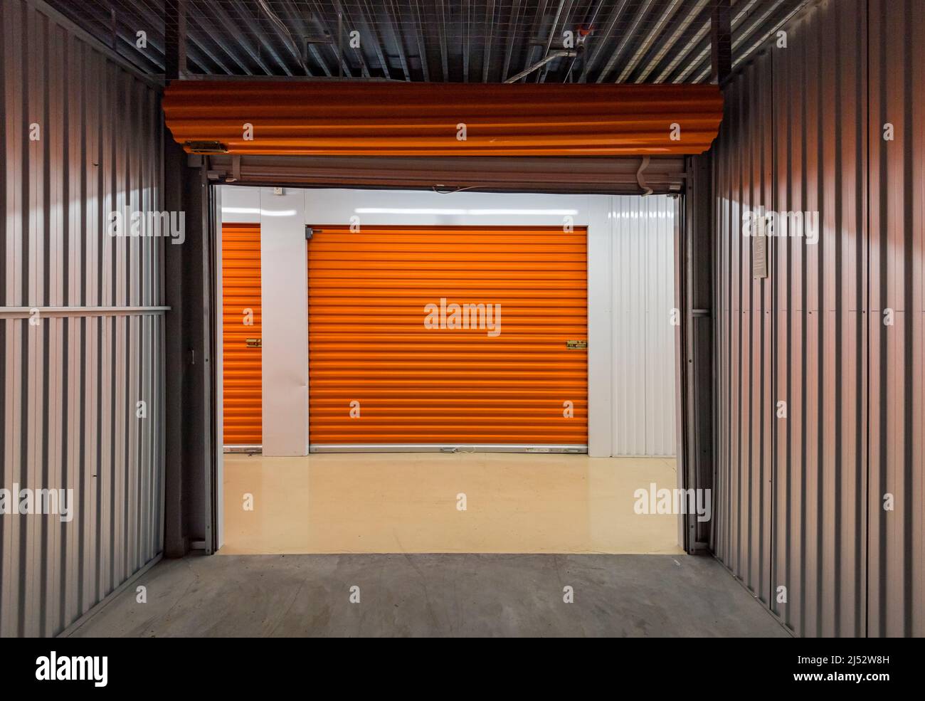 Empty self storage unit as seen from inside looking out Stock Photo