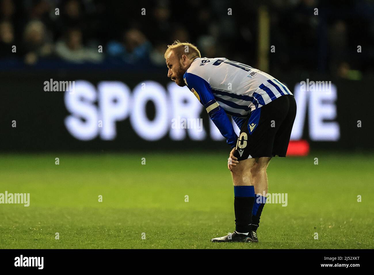 Barry Bannan #10 of Sheffield Wednesday pauses to catch his breath after making a run Stock Photo