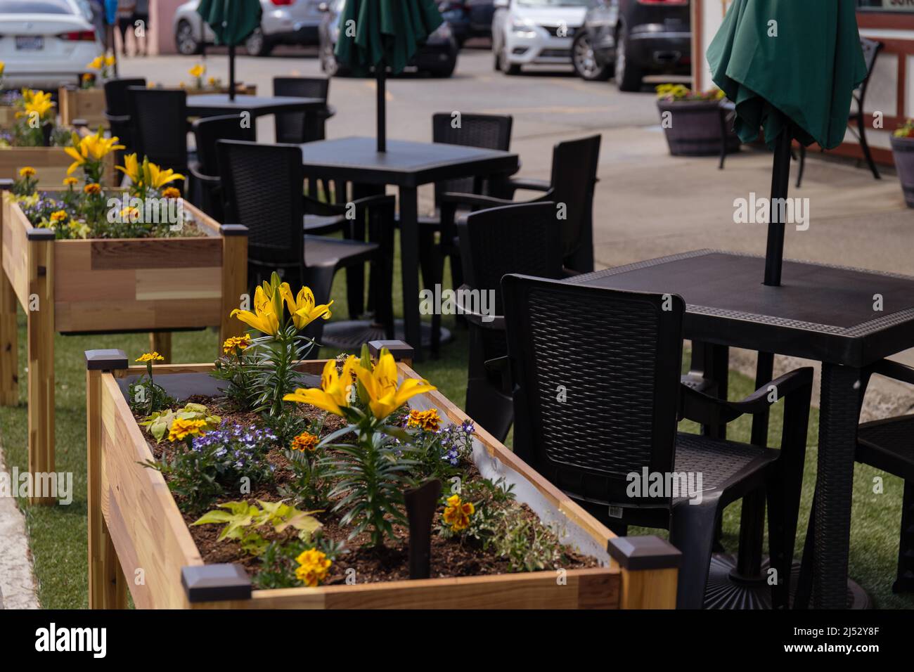 Outdoor Dining at a Restaurant in Leavenworth, WA with Flower Boxes Stock Photo