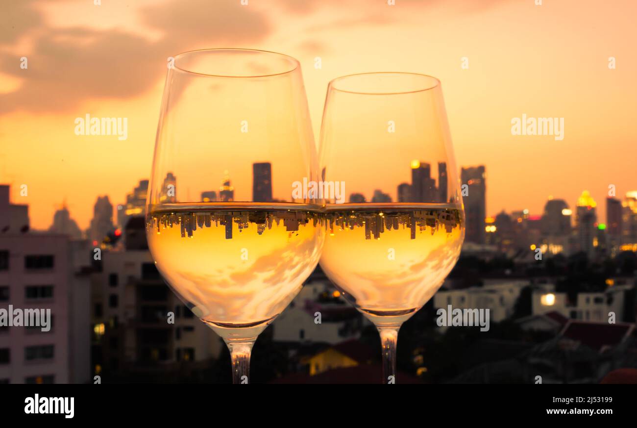 https://c8.alamy.com/comp/2J53199/pair-of-wine-glasses-on-city-background-2J53199.jpg