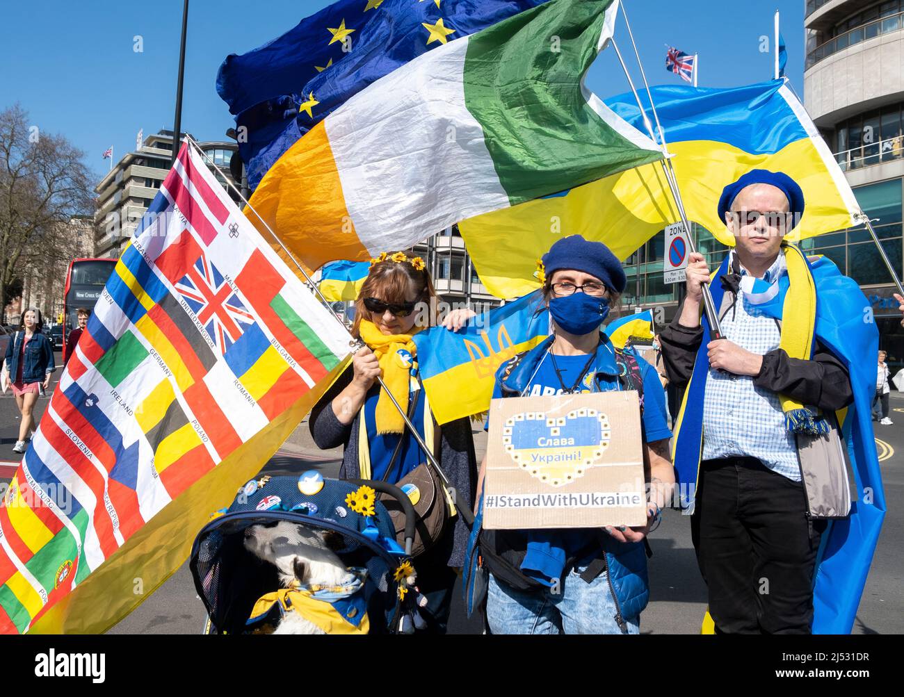 Protesters at the London Stands With Ukraine demonstration rally, central London, in protest of President Vladimir Putin's Russian invasion of Ukraine. Stock Photo