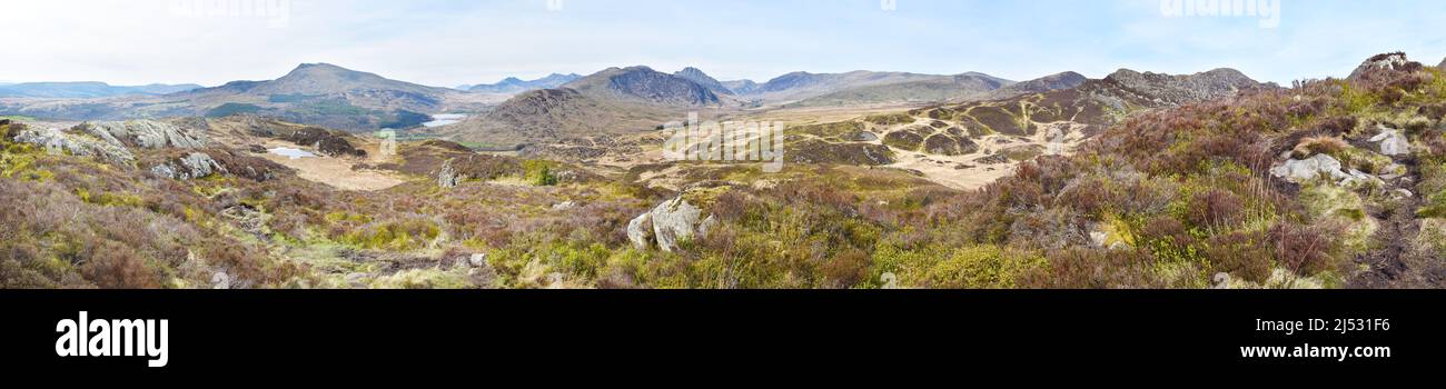 Large panorama of the countryside in Snowdonia, Wales, UK. The background includes Mt Snowdon, Y Lliwedd, Crib y Ddysgl, Crib Goch and Glyder Fawr. Stock Photo