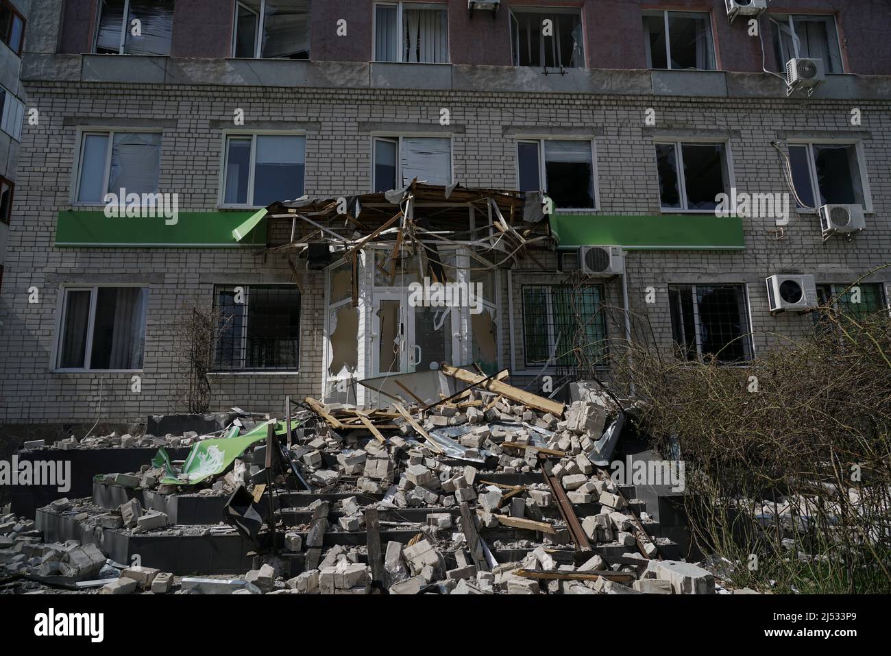 Facade of a destroyed building in Ukraine after a shell explosion Stock