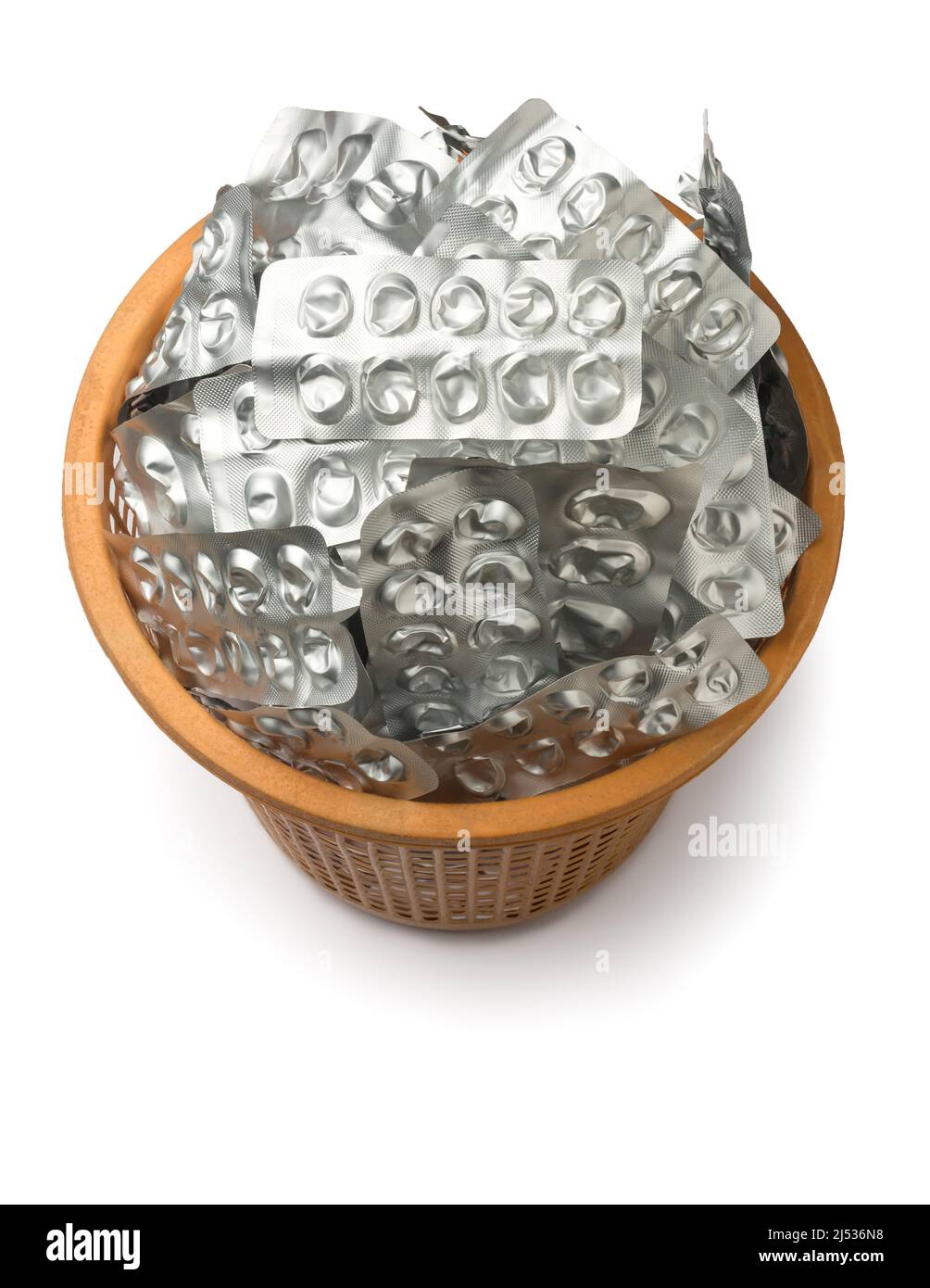 dustbin full of used empty pill blister packs, silver medicine packets in a plastic container, treatment and medication concept, taken from above Stock Photo
