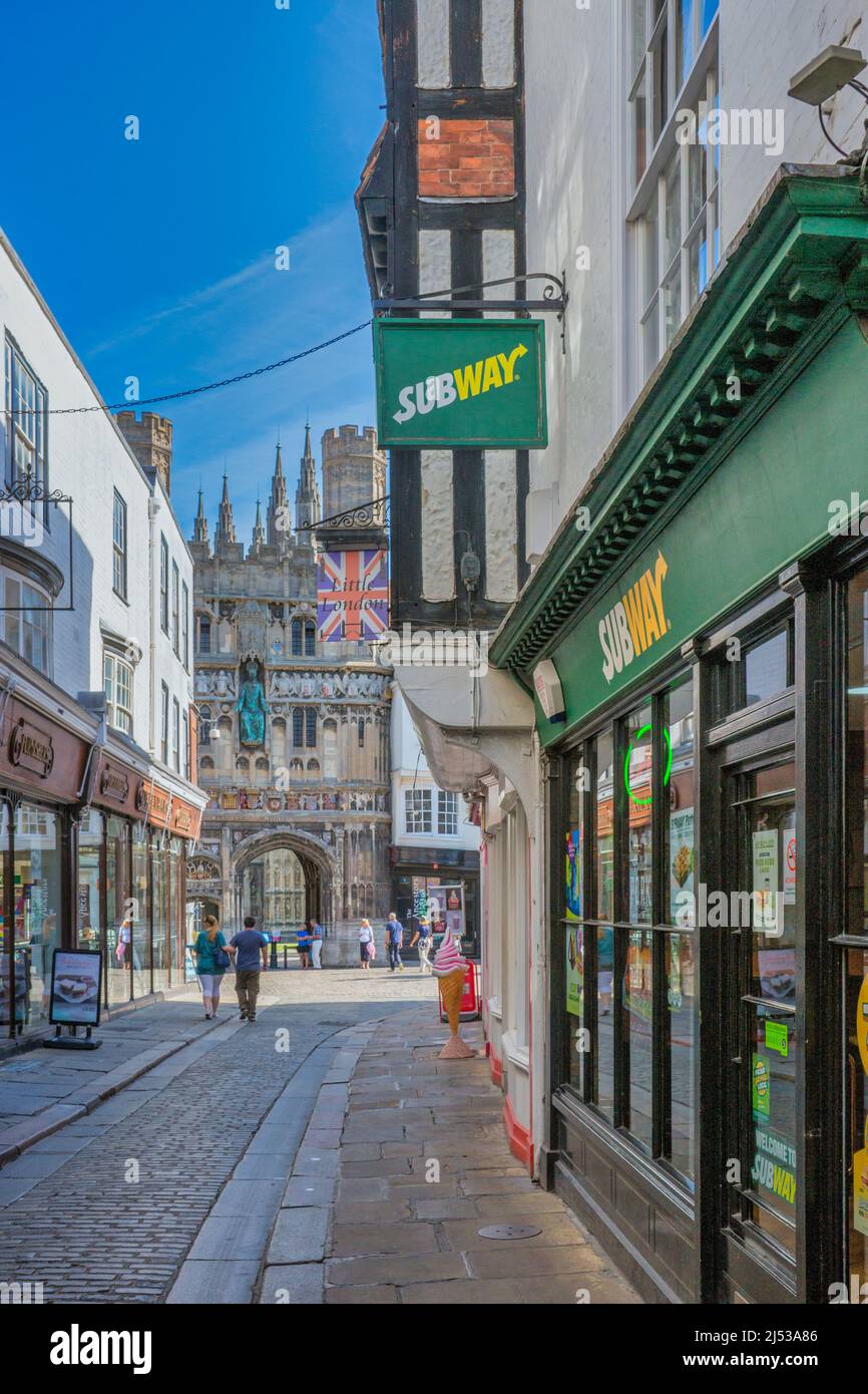 Looking along Saint Margaret’s Street to the Christchurch Gate entrance of Canterbury Cathedral in England. Stock Photo