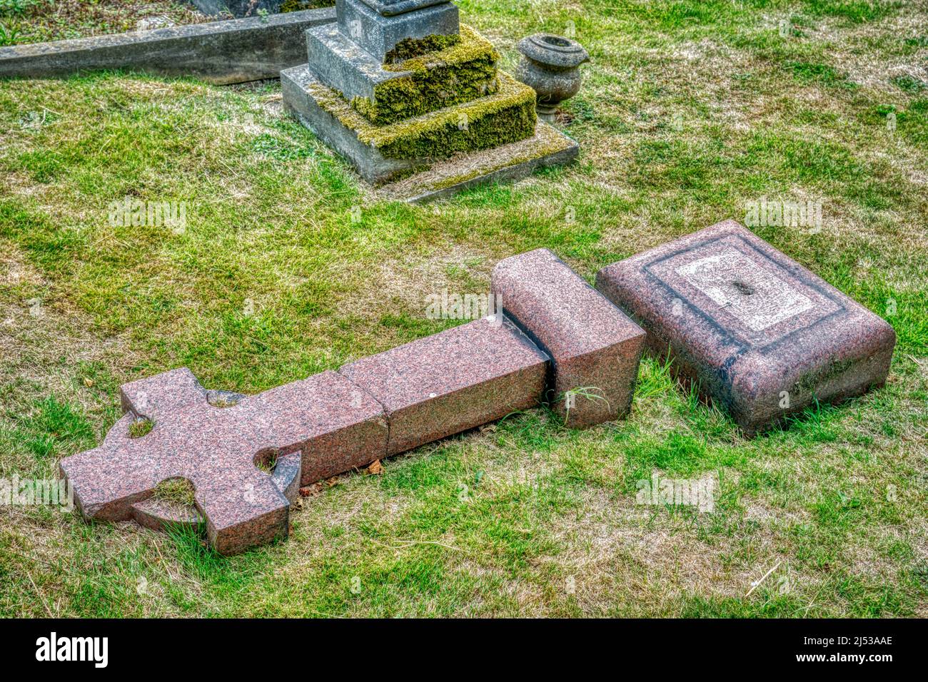 A fallen granite cross in the cemetery of St. Martins, the oldest