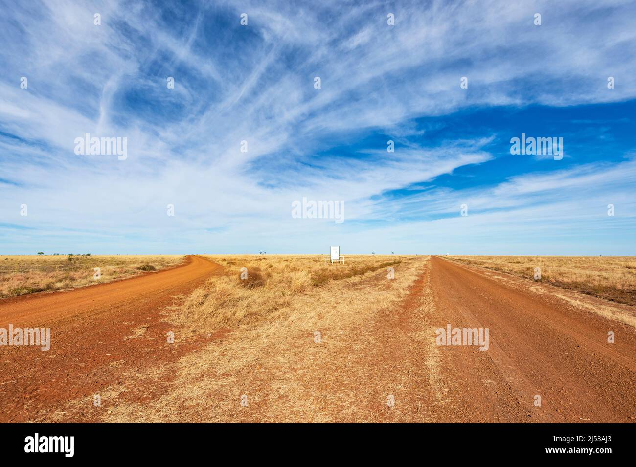 Gravel roads through the remote barren plains of the historic Barkly Stock Route, Barkly Tablelands, Northern Territory, NT, Australia Stock Photo
