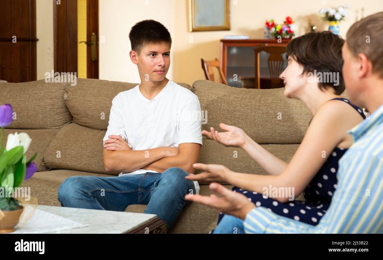 Parents scolding their young son Stock Photo