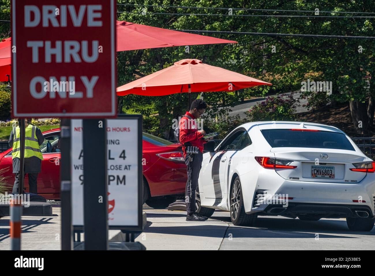 Chick-fil-A restaurant employees taking food orders from drive-thru customers in Decatur, Georgia, just east of Atlanta. (USA) Stock Photo