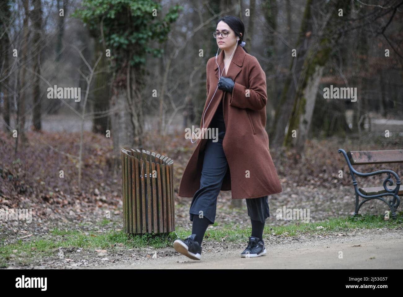 Woman walking alone hi-res stock photography and images - Alamy