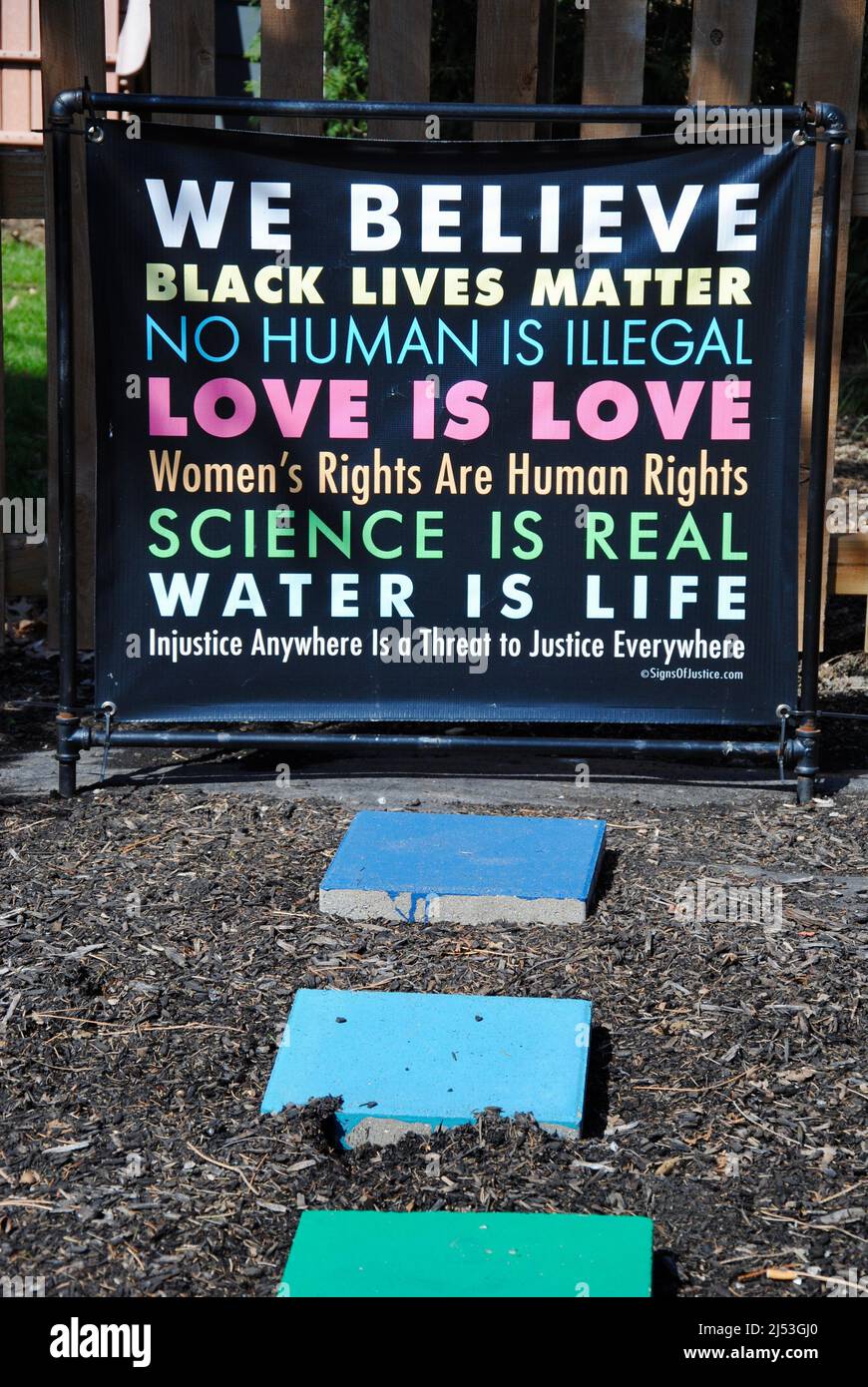 'We believe' sign on a black board in a garden in Lakewood, Ohio Stock Photo