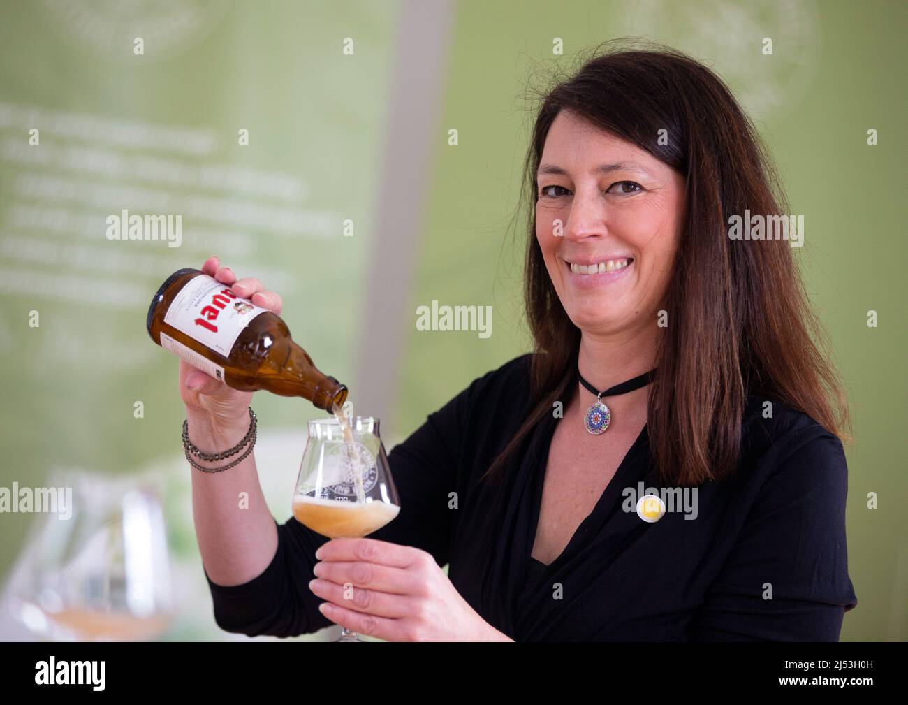 Bonn, Germany. 13th Apr, 2022. Beer sommelier Jutta Knoll pours herself a glass of beer. In