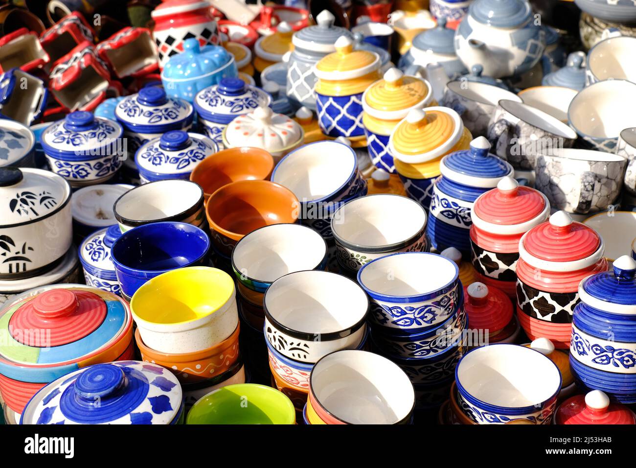 Multicolored Household ceramic items in the Street Market. Stock Photo