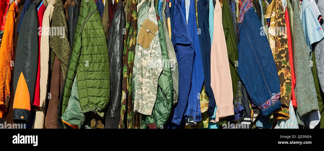 A row of jackets, coats and clothes Stock Photo