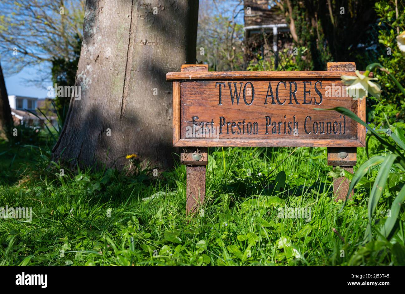 Sign at Two Acres, a small copse (a small wood) in Spring in East Preston, West Sussex, England, UK. Stock Photo