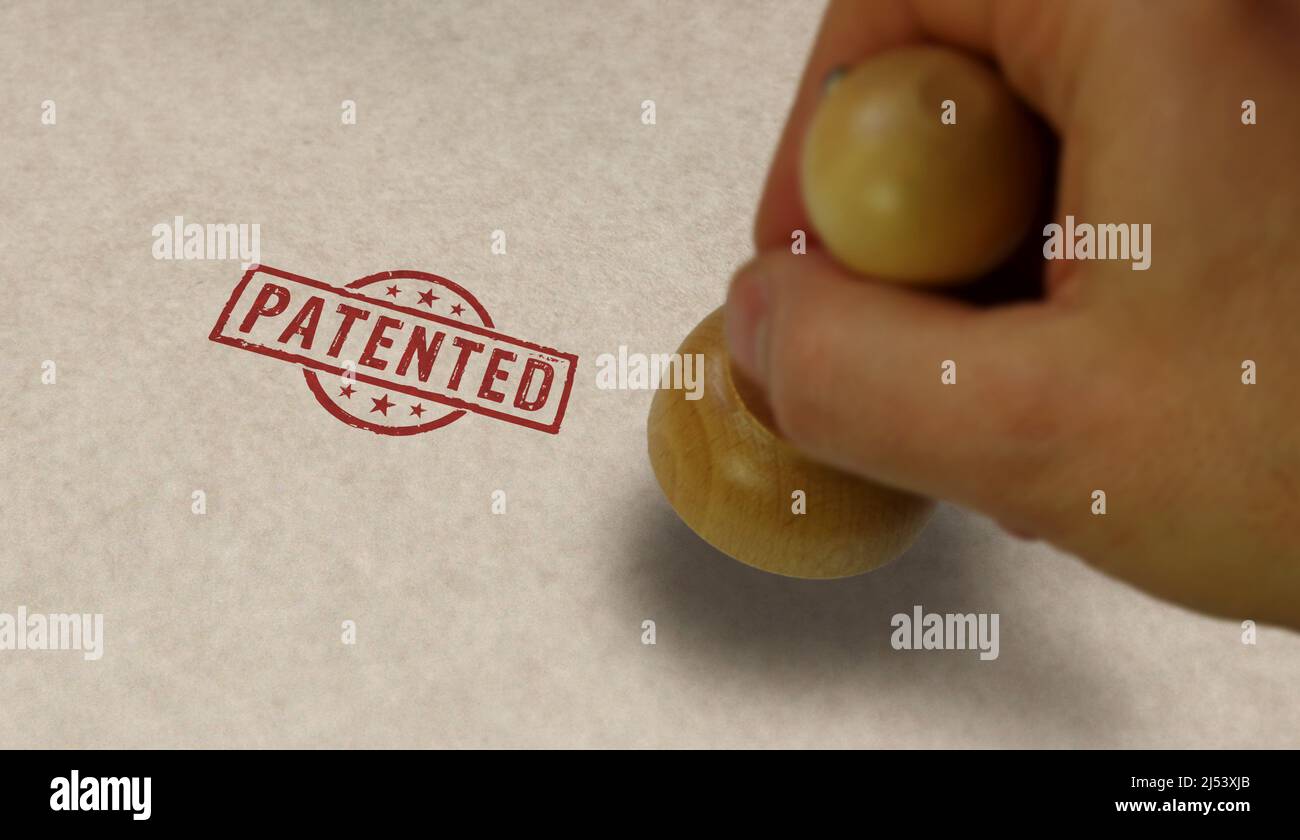 Patented stamp and stamping hand. Patent pending, reserved, copyright and protection of intellectual property concept. Stock Photo
