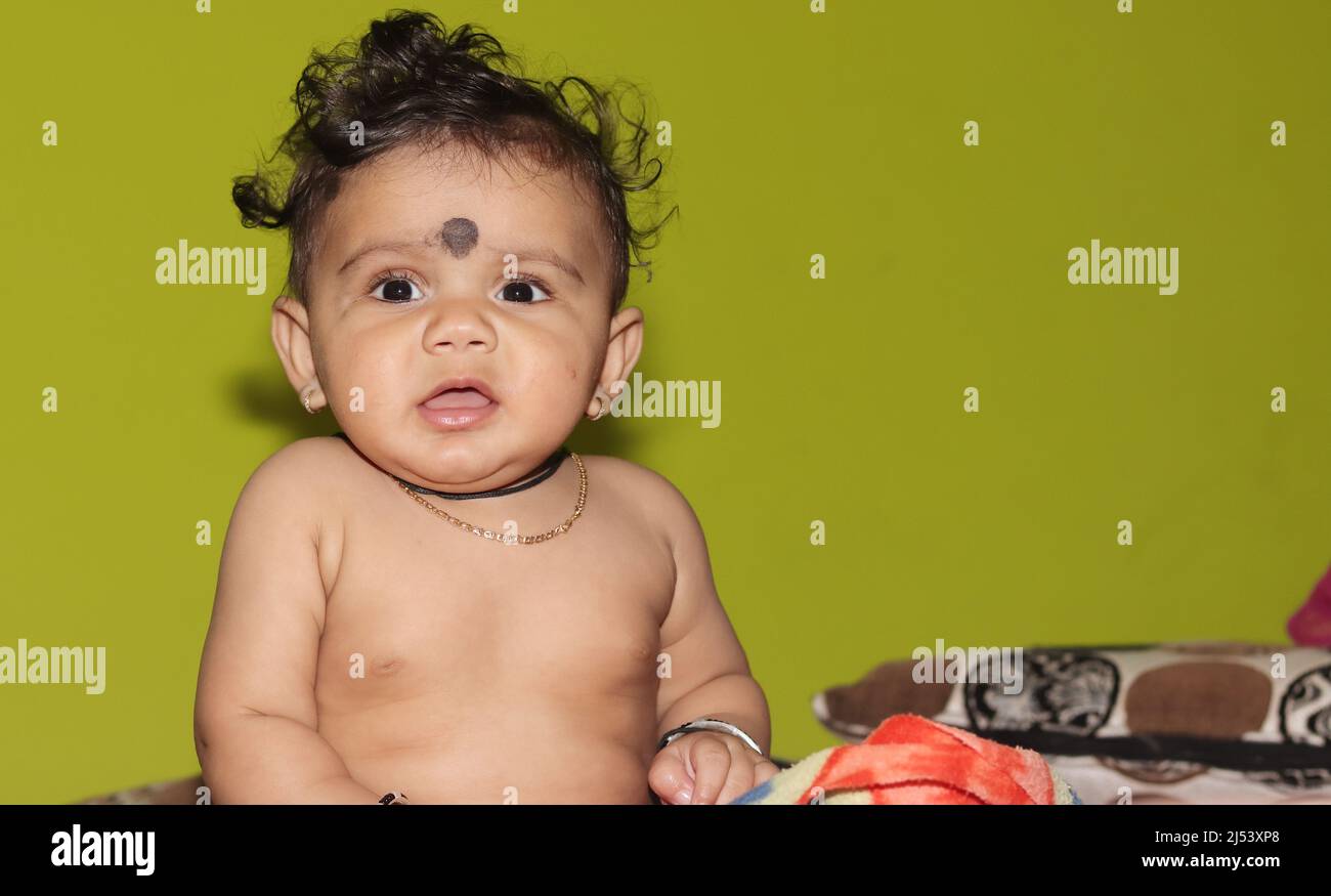 Closeup portrait photo of A lovely cute little Indian hindu baby boy