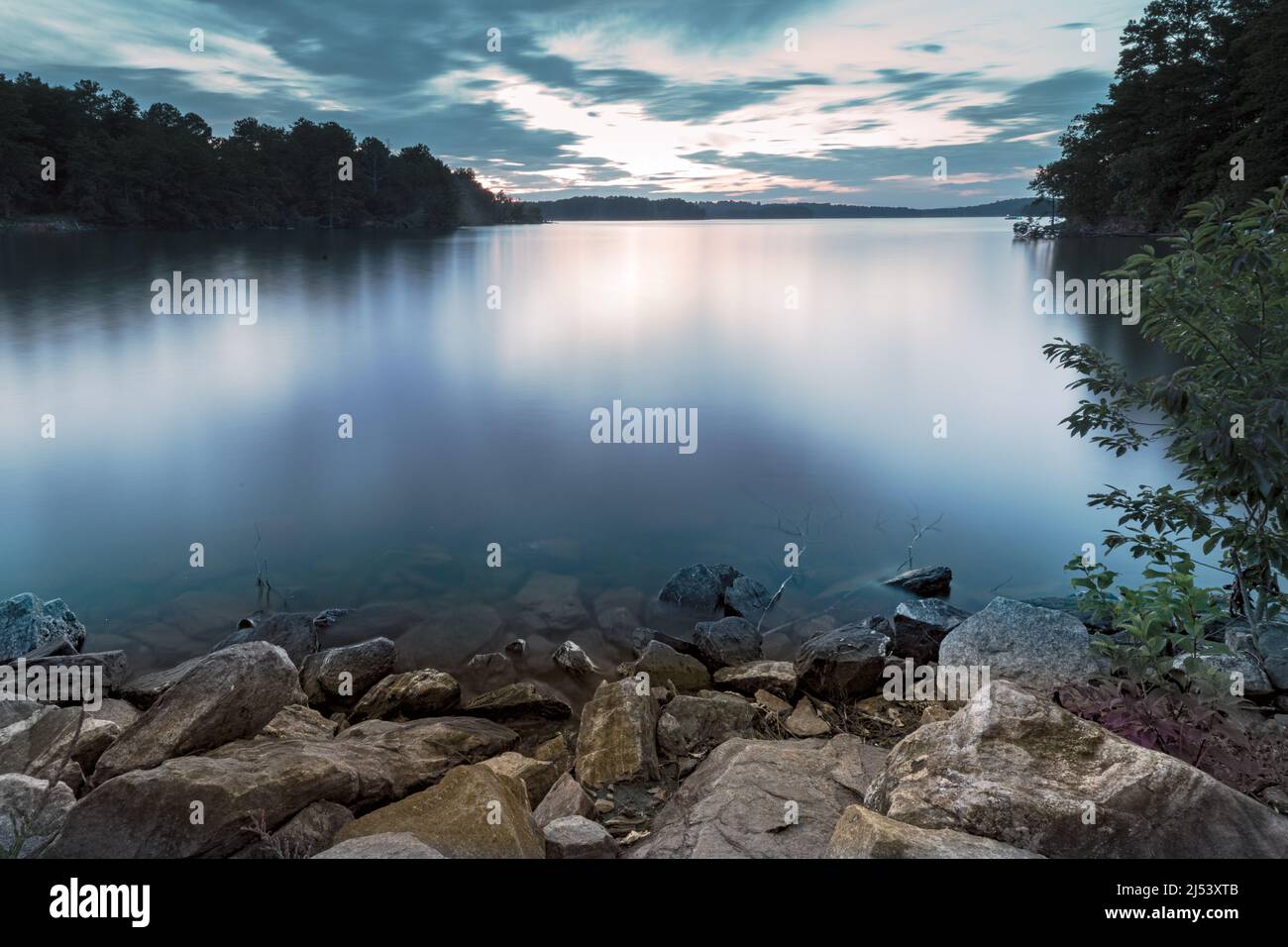 Shore out onto the lake in the evening. Stock Photo