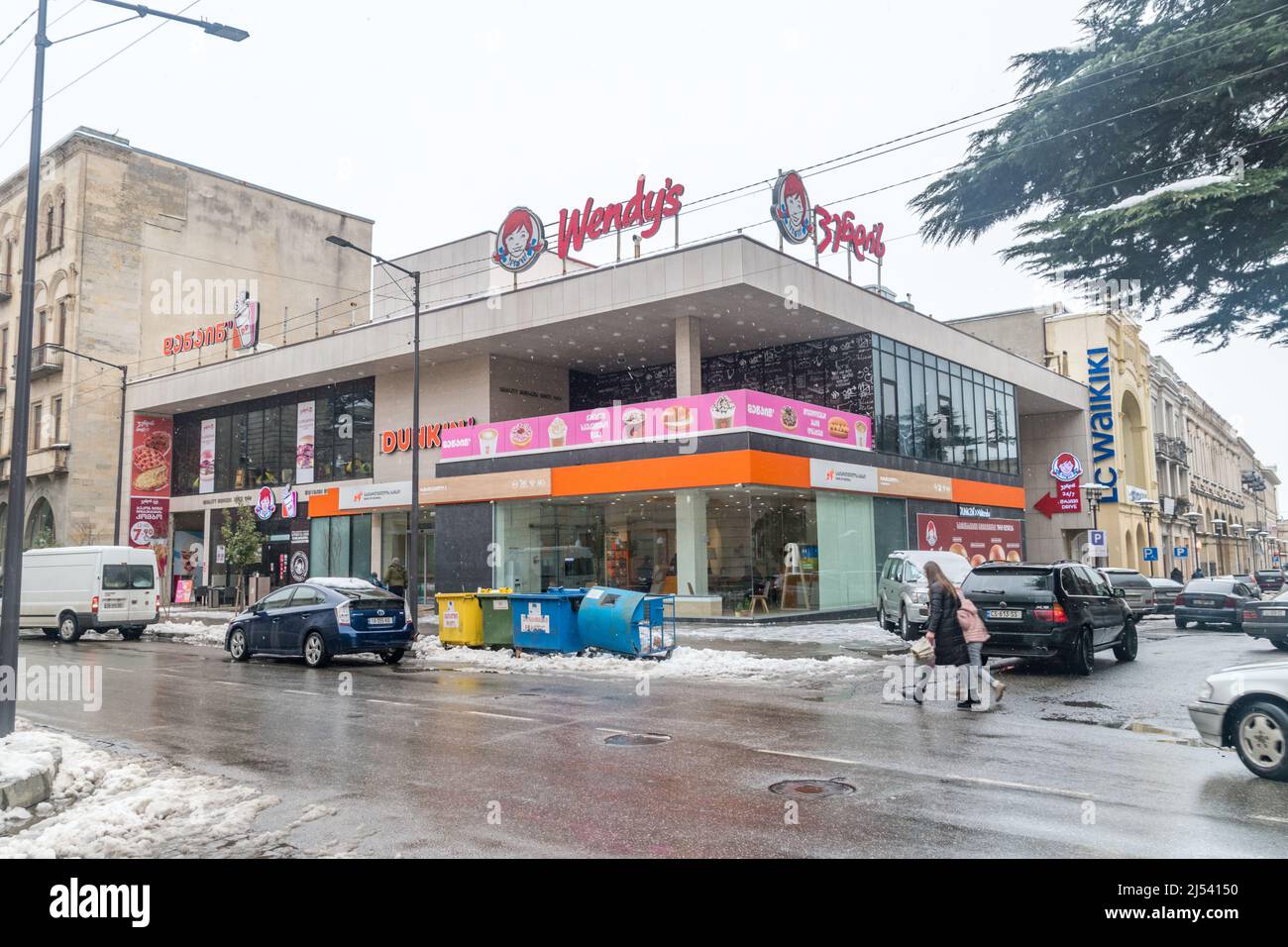 Kutaisi, Georgia - March 17, 2022: Dunkin’ Donuts and Wendy's restaurant in Kutaisi. Dunkin' Donuts is American multinational coffee and doughnut comp Stock Photo
