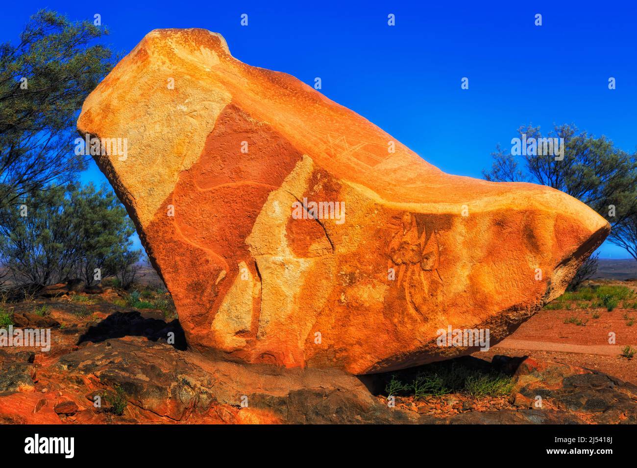 Huge sandstone rock boulder with carvign in Broken hill city public park of Australian outback. Stock Photo