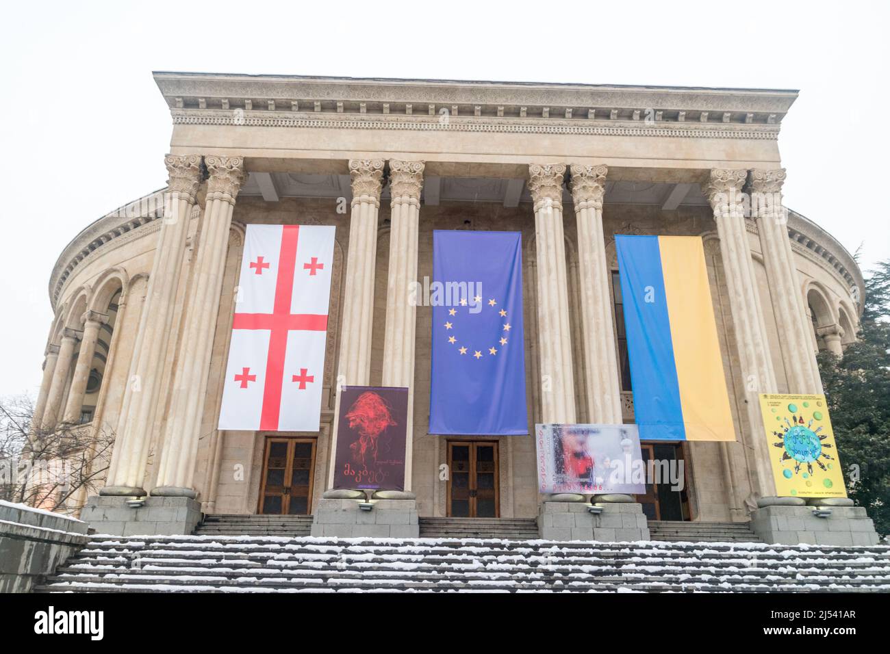 Kutaisi, Georgia - March 17, 2022: Georgian, Europe Union and Ukraine flags on Meskhishvili Theatre. Stock Photo