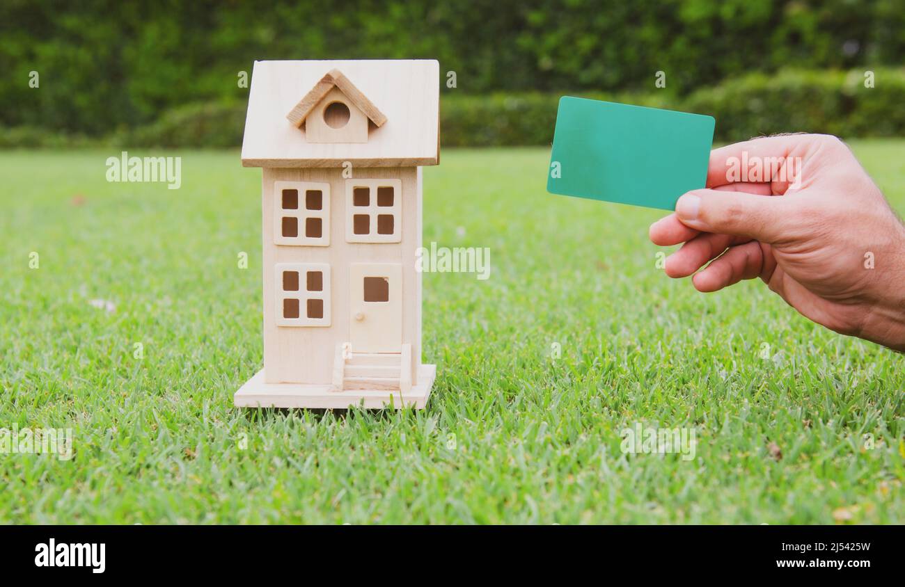 House and credit card. Invest in real estate concept Stock Photo Alamy
