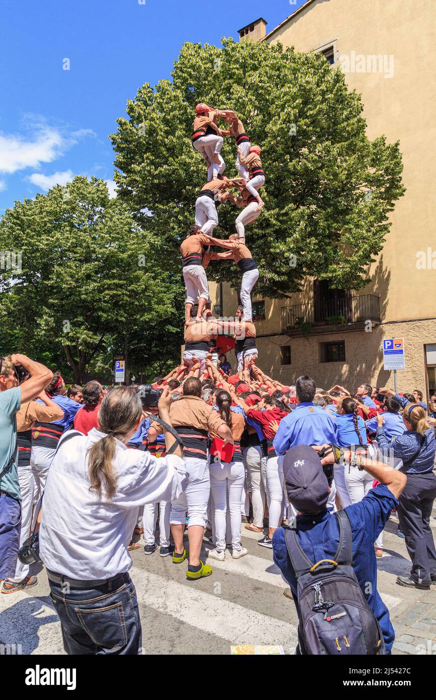 GIRONA, SPAIN - MAY 14, 2017: This is the fall of a constructed tower of people, called castel, during the city the Flower Festival. Stock Photo