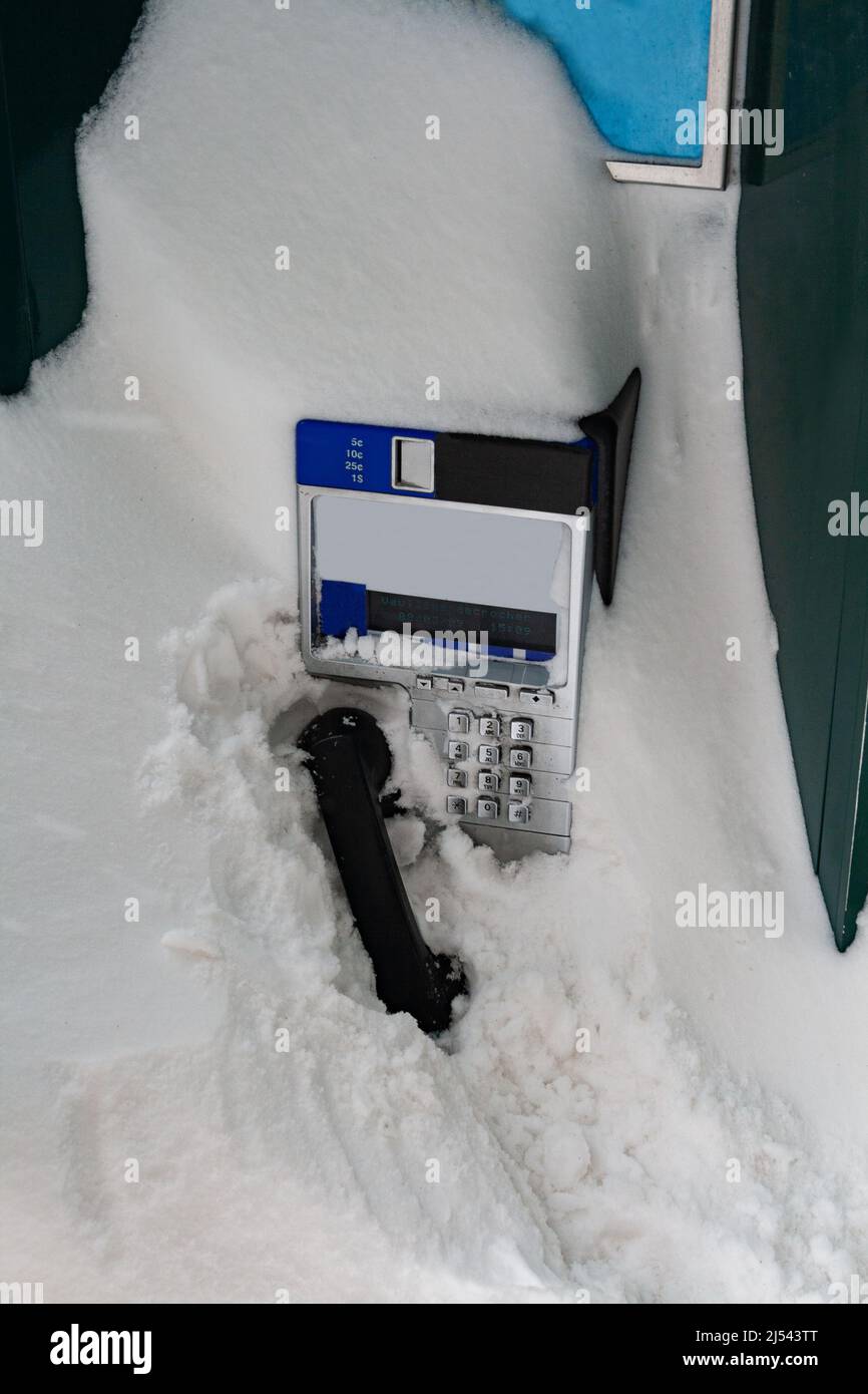 Street phone completely covered with snow in Quebec city Stock Photo