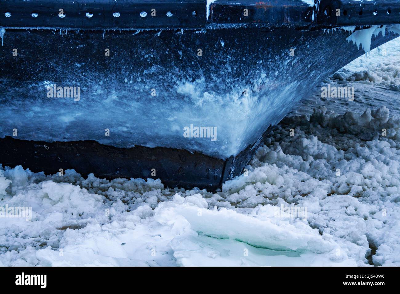 Close-up of ferry ship going through ice and snow Stock Photo