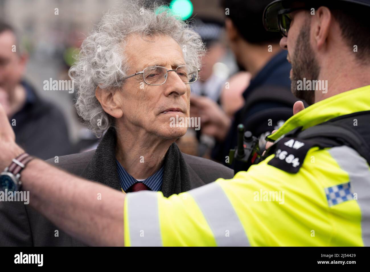 As Prime Minister Boris Johnson was due to apologise to parliament about his fixed-penalty fine for being present at a party during his own Covid pandemic restrictions, Piers Corbyn and anti-vaxx freedom of speech protesters block the gates of parliament during an altercation with Tory MP Bob Blackman, on 19th April 2022, in London, England. The Met police continue to investigate Johnson and his staff as news of more lockdown party fines are expected to be revealed by police. Stock Photo