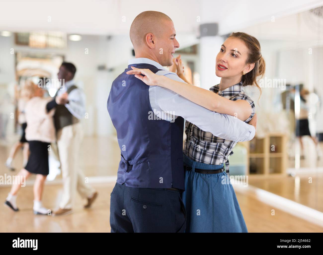 Man and woman learning to dance classical ballroom dance Stock Photo
