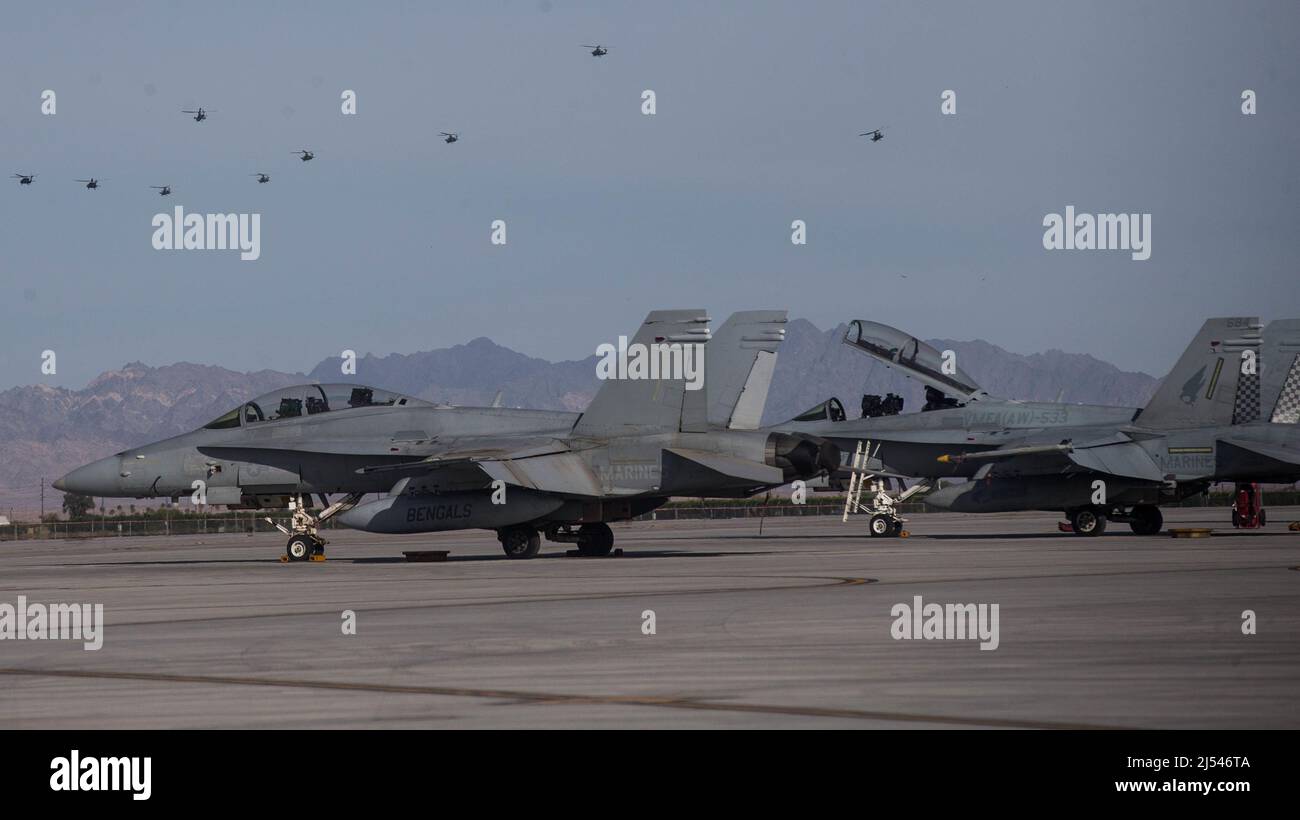 U.S. Marine Corps F/A-18 Hornets assigned to Marine Aviation Weapons and Tactics Squadron One (MAWTS-1) are staged on a flight line during Weapons and Tactics Instructor (WTI) course 2-22, at Marine Corps Air Station Yuma, Arizona, on April 15, 2022.  WTI is a seven-week training event hosted by MAWTS-1, providing standardized advanced tactical training and certification of unit instructor qualifications to support Marine aviation training and readiness, and assists in developing and employing aviation weapons and tactics. (U.S. Marine Corps photo by Lance Cpl. Emily Weiss) Stock Photo