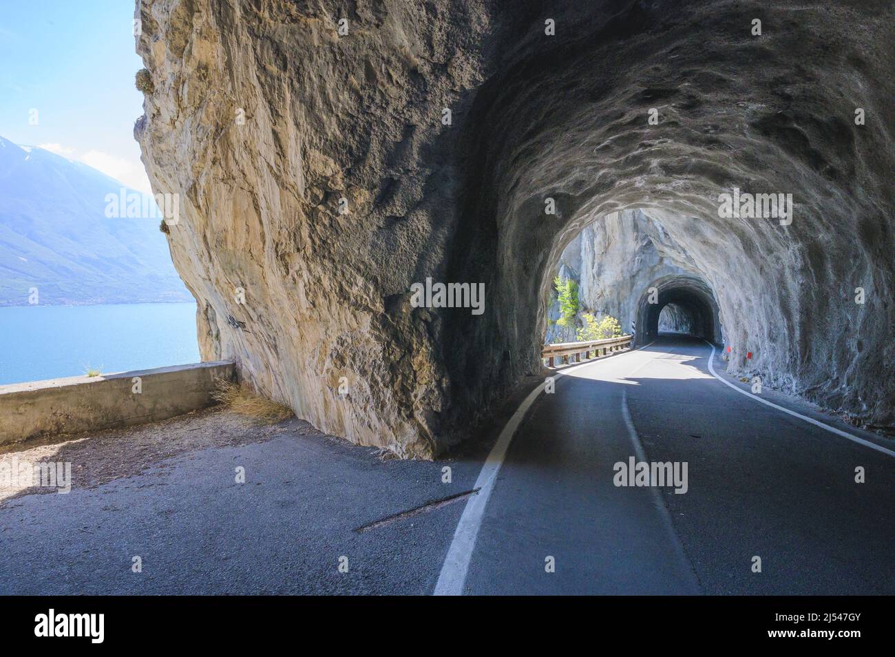 STRADA DELLA FORRA, narrow Italian road with tunnel in the mountains, Lake Garda, Italy Stock Photo