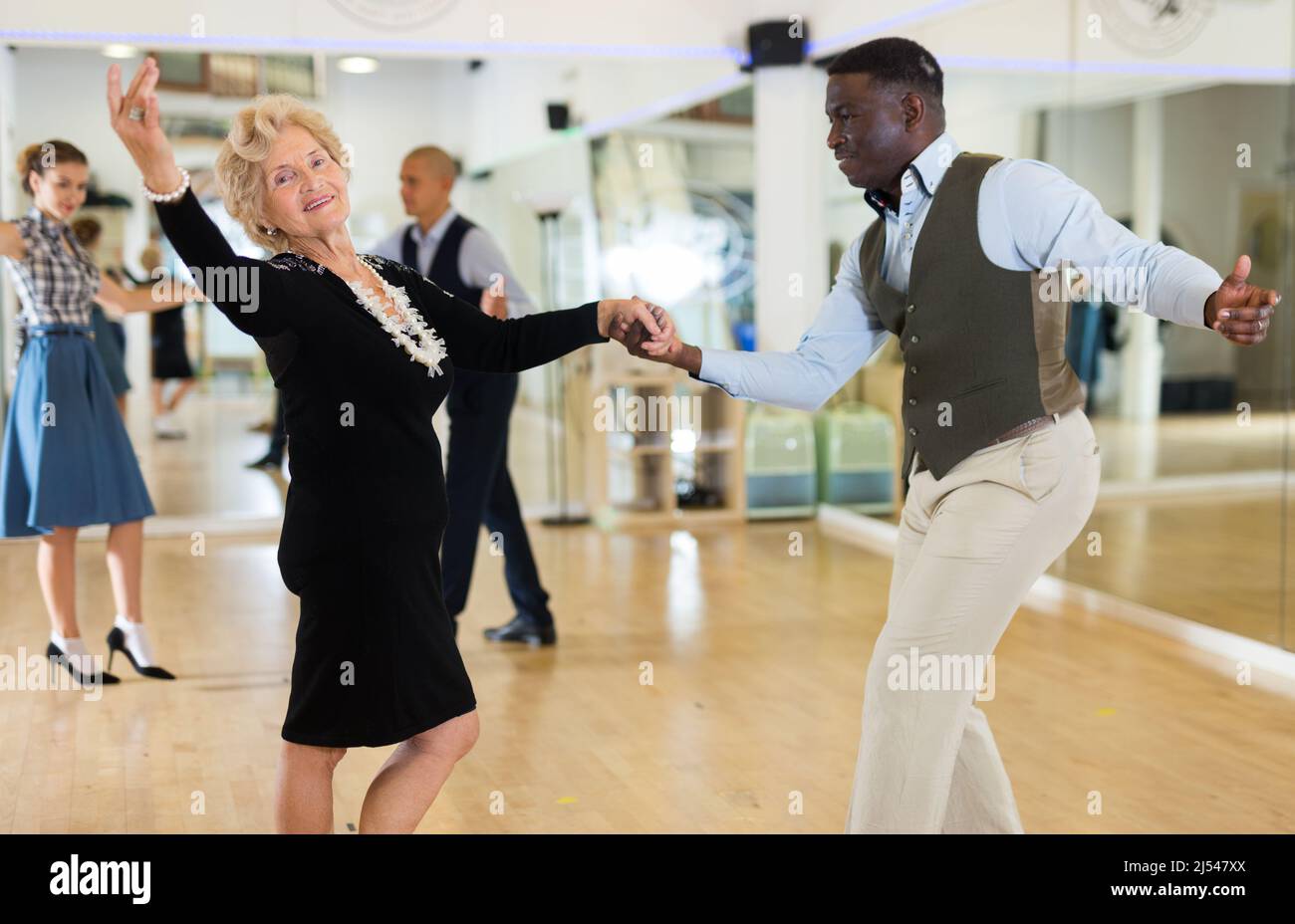 Two professional dancers practicing lindy hop in dance class Stock Photo