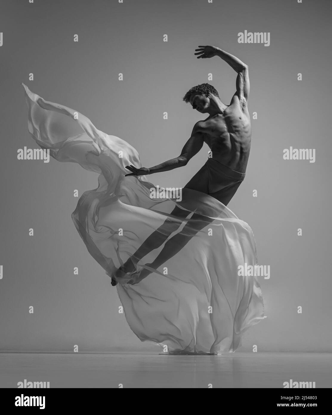 Hope. Black and white portrait of graceful muscled male ballet dancer