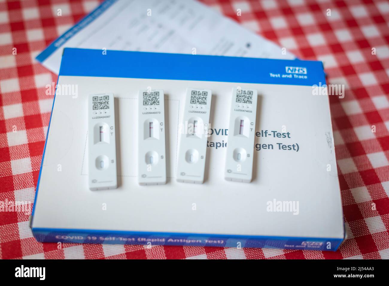 Coronavirus (COVID-19) rapid lateral flow tests at home, three negative and positive results, UK Stock Photo