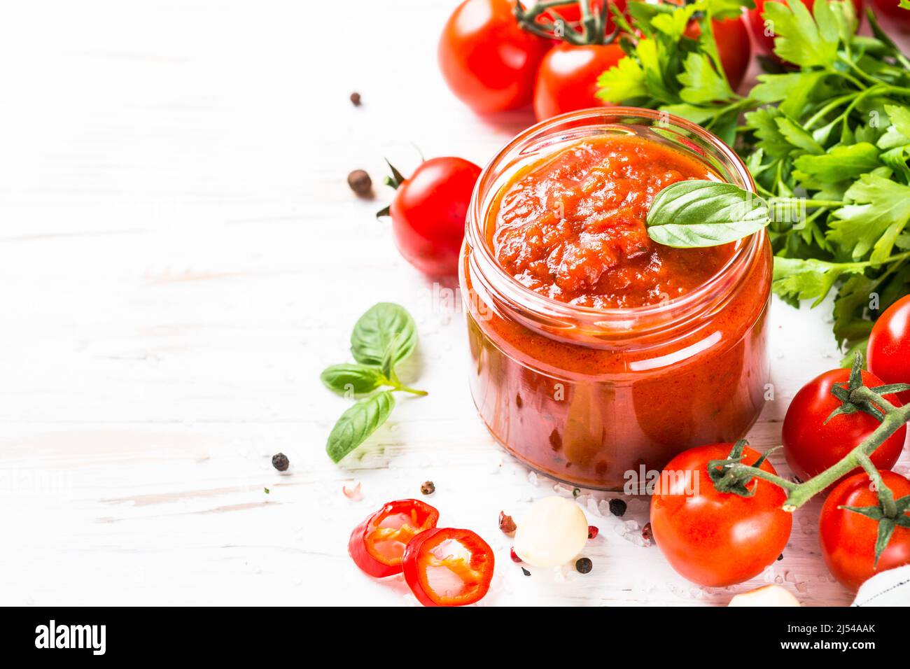 Tomato sauce with herbs and spices at white background Stock Photo Alamy
